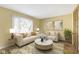 Living room with light beige walls, hardwood floors and stylish furniture at 956 Dorchester Dr, Noblesville, IN 46062
