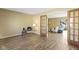 Living room with hardwood floors, French doors and view to backyard at 956 Dorchester Dr, Noblesville, IN 46062