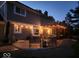 Evening view of a lovely patio with pergola and string lights at 956 Dorchester Dr, Noblesville, IN 46062