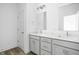 Modern bathroom with double vanity and gray cabinets at 9893 Greenvine Dr, Carmel, IN 46032