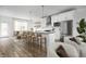 Modern kitchen with white cabinets, island, and stainless steel appliances at 9893 Greenvine Dr, Carmel, IN 46032