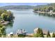 Stunning aerial view of the lake and homes, showcasing the waterfront property at 10841 W Grandview Dr, Columbus, IN 47201