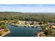 Panoramic aerial view of lakefront homes nestled amidst lush trees, offering serene waterfront living at 10841 W Grandview Dr, Columbus, IN 47201
