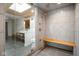 Modern bathroom featuring a spacious glass shower with wood bench and slate tile flooring at 10841 W Grandview Dr, Columbus, IN 47201