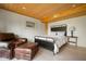 Bedroom featuring a wood ceiling, a cozy chair and a queen size bed at 10841 W Grandview Dr, Columbus, IN 47201