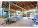 Outdoor dining area located in the covered boat dock, perfect for lakeside meals at 10841 W Grandview Dr, Columbus, IN 47201