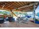 Inviting dockside seating area featuring a dining table and wicker seating overlooking the lake at 10841 W Grandview Dr, Columbus, IN 47201