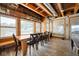 Dining area with exposed wood ceiling beams, plenty of natural light and water views at 10841 W Grandview Dr, Columbus, IN 47201