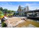 Beautiful waterfront home featuring a stone fireplace, patio, deck, and water access at 10841 W Grandview Dr, Columbus, IN 47201