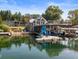 Beautiful waterfront home with a private dock, boat slip, slide, and rooftop deck overlooking the calm lake waters at 10841 W Grandview Dr, Columbus, IN 47201