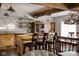 Charming kitchen with wooden cabinets, open shelving, and a stylish island with seating at 10841 W Grandview Dr, Columbus, IN 47201