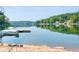 A serene view of the lake with forested hills visible in the background from the house at 10841 W Grandview Dr, Columbus, IN 47201