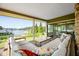 Spacious screened porch with comfortable seating and stunning lake view at 10841 W Grandview Dr, Columbus, IN 47201