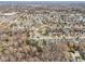 High-angle view of the neighborhood highlighting ponds, cul-de-sacs, and nearby shopping centers at 10842 Belmont Cir, Indianapolis, IN 46280