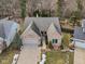 Aerial shot of neighborhood, manicured lawns, mature trees, and neighboring houses at 10842 Belmont Cir, Indianapolis, IN 46280