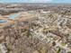 Bird's eye view showcases the property's proximity to a pond, shopping area, and roads at 10842 Belmont Cir, Indianapolis, IN 46280