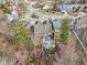 Aerial view of a home featuring a stone patio, a deck, and a fire pit in the backyard at 10842 Belmont Cir, Indianapolis, IN 46280