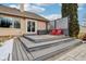 A backyard features a multi-tiered deck with seating next to the house with gray siding and trim at 10842 Belmont Cir, Indianapolis, IN 46280