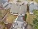 Drone image of the home showing a patio with a fire pit and a backyard deck with furniture at 10842 Belmont Cir, Indianapolis, IN 46280