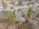 Backyard aerial shows the stone patio, deck, and landscaped features of the property at 10842 Belmont Cir, Indianapolis, IN 46280