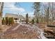 Large, private backyard with an outdoor fireplace and plenty of space for entertaining at 10842 Belmont Cir, Indianapolis, IN 46280