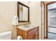 Well-maintained bathroom with vanity, towel, toilet, and a doorway into another room at 10842 Belmont Cir, Indianapolis, IN 46280