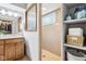 Well-appointed bathroom with a walk-in shower, functional shelving, and an adjoining walk-in closet at 10842 Belmont Cir, Indianapolis, IN 46280