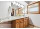 Bathroom showcasing double sinks, a large mirror, stylish vanity, and modern lighting at 10842 Belmont Cir, Indianapolis, IN 46280