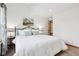 Relaxing bedroom with a well-made bed and neutral decor; a doorway leads to another space at 10842 Belmont Cir, Indianapolis, IN 46280