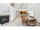Bright dining area featuring a modern kitchen and a view of the fireplace at 10842 Belmont Cir, Indianapolis, IN 46280