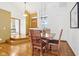 Dining area with hardwood floors, stylish furniture, and natural lighting at 10842 Belmont Cir, Indianapolis, IN 46280