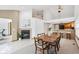 Open floor plan with a fireplace and dining area leading to the kitchen at 10842 Belmont Cir, Indianapolis, IN 46280