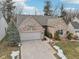 Charming brick home featuring an attached two-car garage, and a well maintained front lawn at 10842 Belmont Cir, Indianapolis, IN 46280