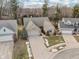 Aerial view of brick home with well-maintained landscaping and a two-car garage at 10842 Belmont Cir, Indianapolis, IN 46280