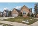 Charming home with a well-kept lawn, stone accents, and mature landscaping at 10842 Belmont Cir, Indianapolis, IN 46280