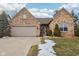 Home's exterior features a well-maintained lawn with stone borders and a walkway leading to the entrance at 10842 Belmont Cir, Indianapolis, IN 46280