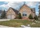 Charming home with a well-kept lawn, stone accents, and mature landscaping at 10842 Belmont Cir, Indianapolis, IN 46280