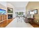 Bright living room with hardwood floors, fireplace, vaulted ceiling, and lots of natural light at 10842 Belmont Cir, Indianapolis, IN 46280