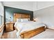 Comfortable main bedroom featuring an accent wall, soft carpet, and wood bedroom set at 10842 Belmont Cir, Indianapolis, IN 46280