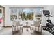 Bright sun room with large windows and a view of the outdoor fireplace at 10842 Belmont Cir, Indianapolis, IN 46280