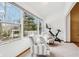 Bright sun room with large windows looking out onto the backyard at 10842 Belmont Cir, Indianapolis, IN 46280