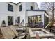 Cozy backyard patio with seating around a fire pit, perfect for relaxing and socializing at 128 Wellington Rd, Indianapolis, IN 46260
