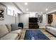 Relaxing basement area with comfortable couches, entertainment center, and stylish decor at 128 Wellington Rd, Indianapolis, IN 46260
