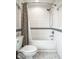 Clean bathroom design with white subway tile, marble floors, and classic fixtures at 128 Wellington Rd, Indianapolis, IN 46260