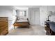 Comfortable bedroom with a classic wooden bed frame, warm carpet, and natural light at 128 Wellington Rd, Indianapolis, IN 46260