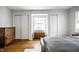 Bright bedroom features hardwood floors, two closets, and a sunny window seat at 128 Wellington Rd, Indianapolis, IN 46260