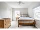 Inviting bedroom with hardwood bed frame, dresser, and neutral decor at 128 Wellington Rd, Indianapolis, IN 46260