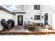 Back deck features a dining table, chairs, and a grill, perfect for outdoor entertaining at 128 Wellington Rd, Indianapolis, IN 46260