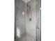 Modern shower with granite tile and sleek fixtures at 128 Wellington Rd, Indianapolis, IN 46260