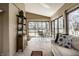 Relaxing sunroom offering ample seating, views, and bright natural sunlight at 128 Wellington Rd, Indianapolis, IN 46260